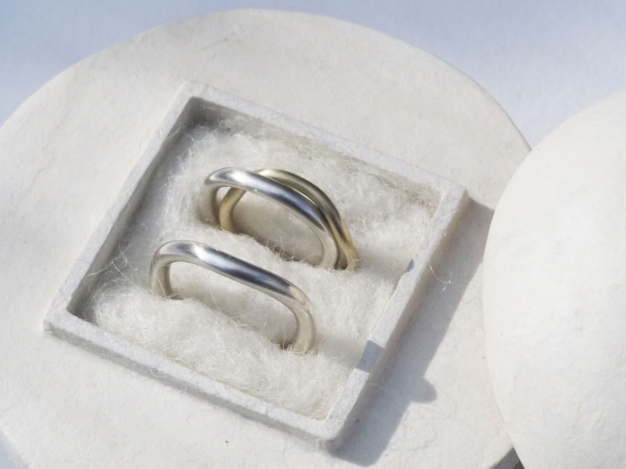 Close-up of sterling silver and gold wedding rings